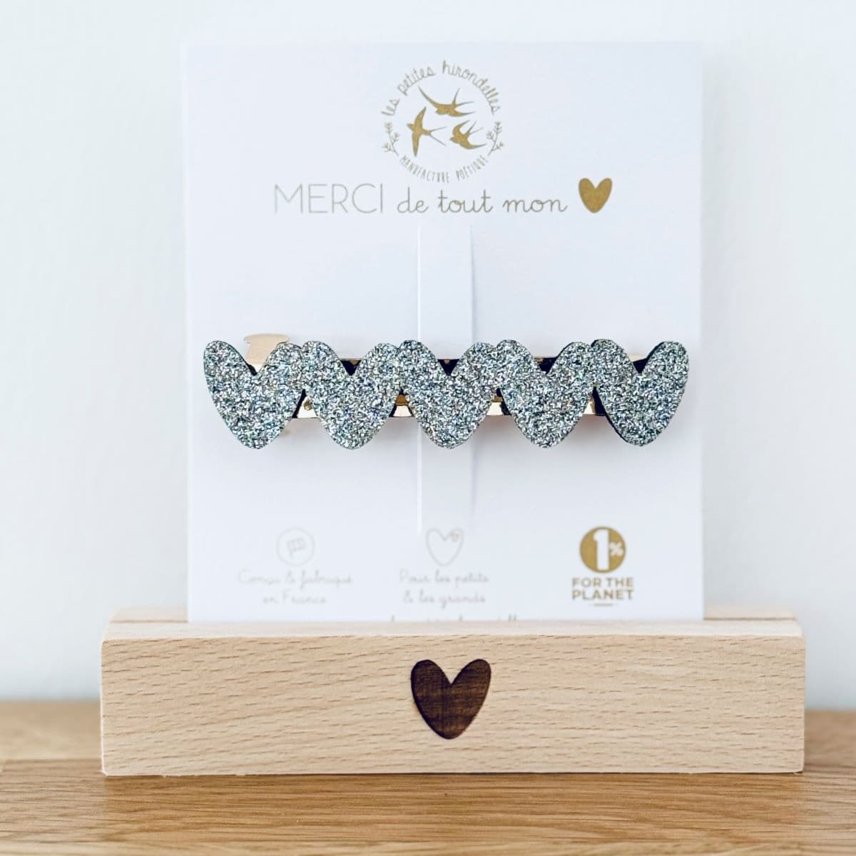 Barrette clip coeur argenté en feutrine pailletée sur une cartonnette "merci de tout mon coeur"
